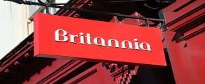 London, United Kingdom, Mar 19, 2011 : Britannia Building Society's red sign hanging outside one of its branches in the City of London. Britannia is a financial service institution and a trading name of the Co-Operative Bank.